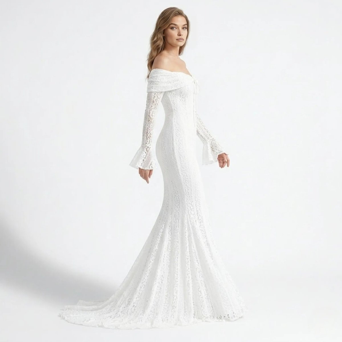 Side profile of woman in Kouvr white floral lace mermaid gown showing elegant back train and fitted affordable luxury silhouette