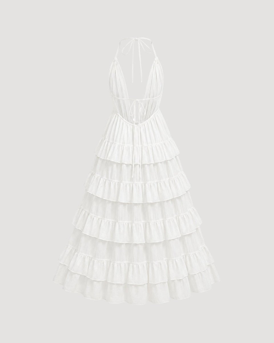 A white halter-neck maxi dress with a tiered ruffled skirt, shown from the back against a light gray background.