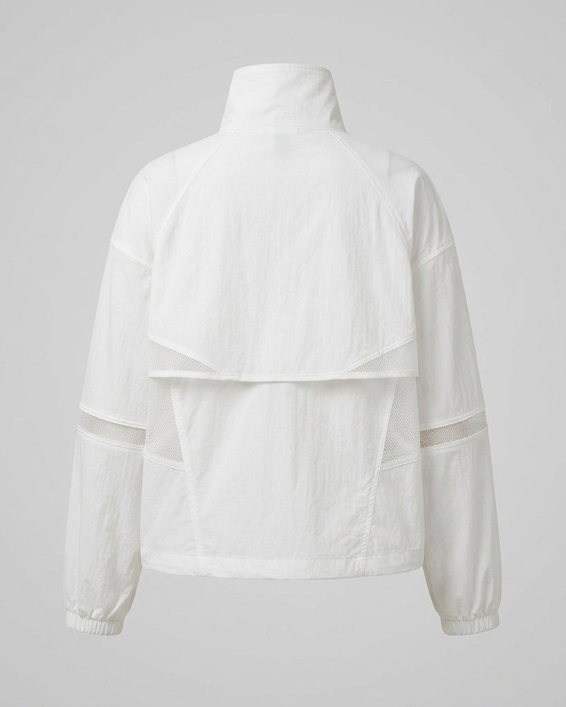 Back product shot of the white sporty outerwear jacket showing back cape detail and mesh