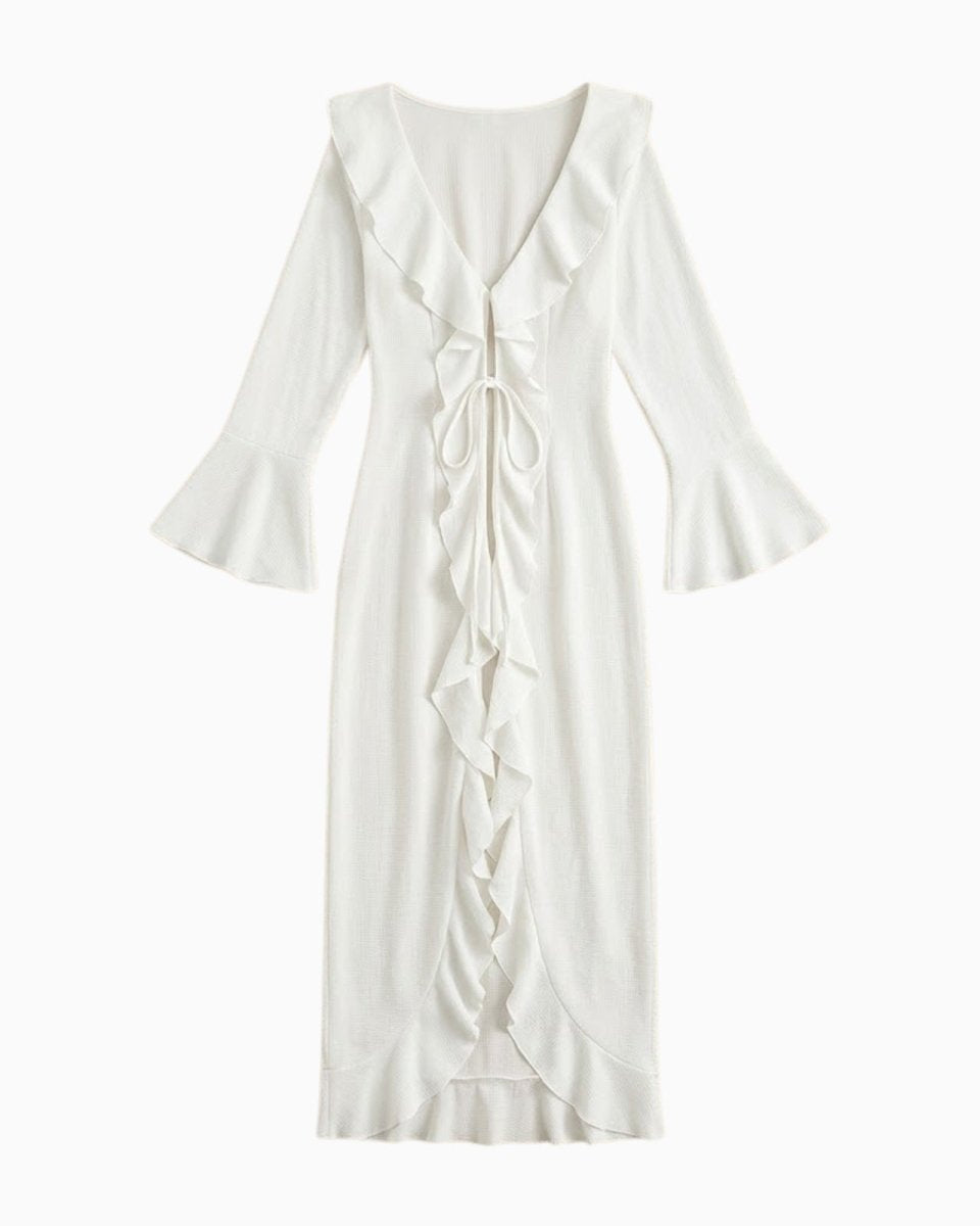 Flatlay of the white ruffle tie-front maxi cover up showing cascading ruffle details and textured fabric.