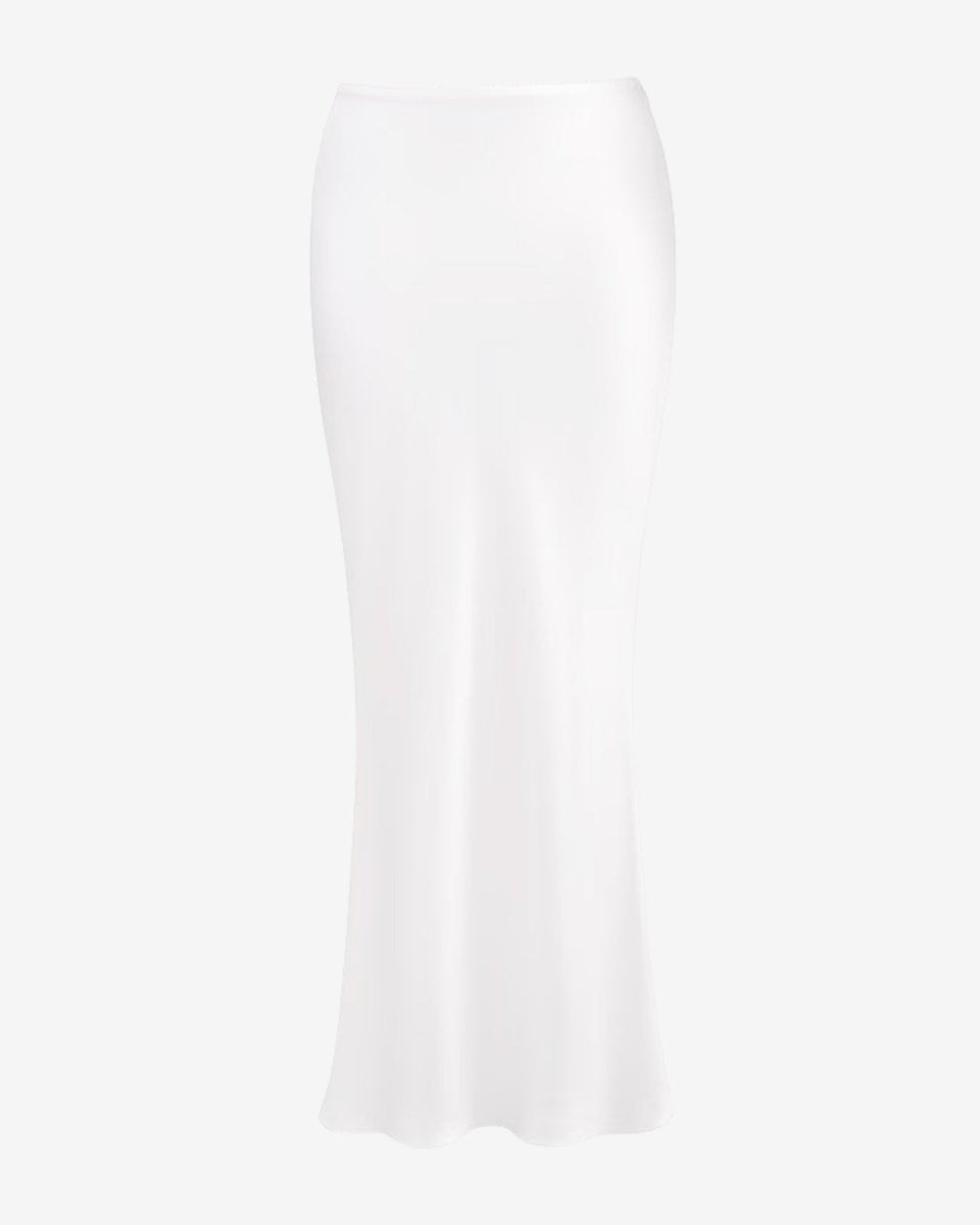 Angled product view of the long white satin slip skirt, highlighting the fabric's luminous texture and quality.