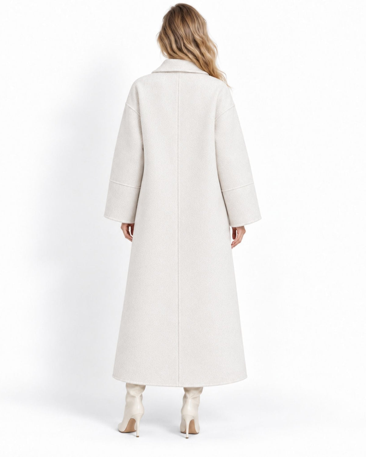 A woman viewed from the back wearing a long, straight-line cream-colored coat and matching cream high-heeled boots against a plain white studio background.