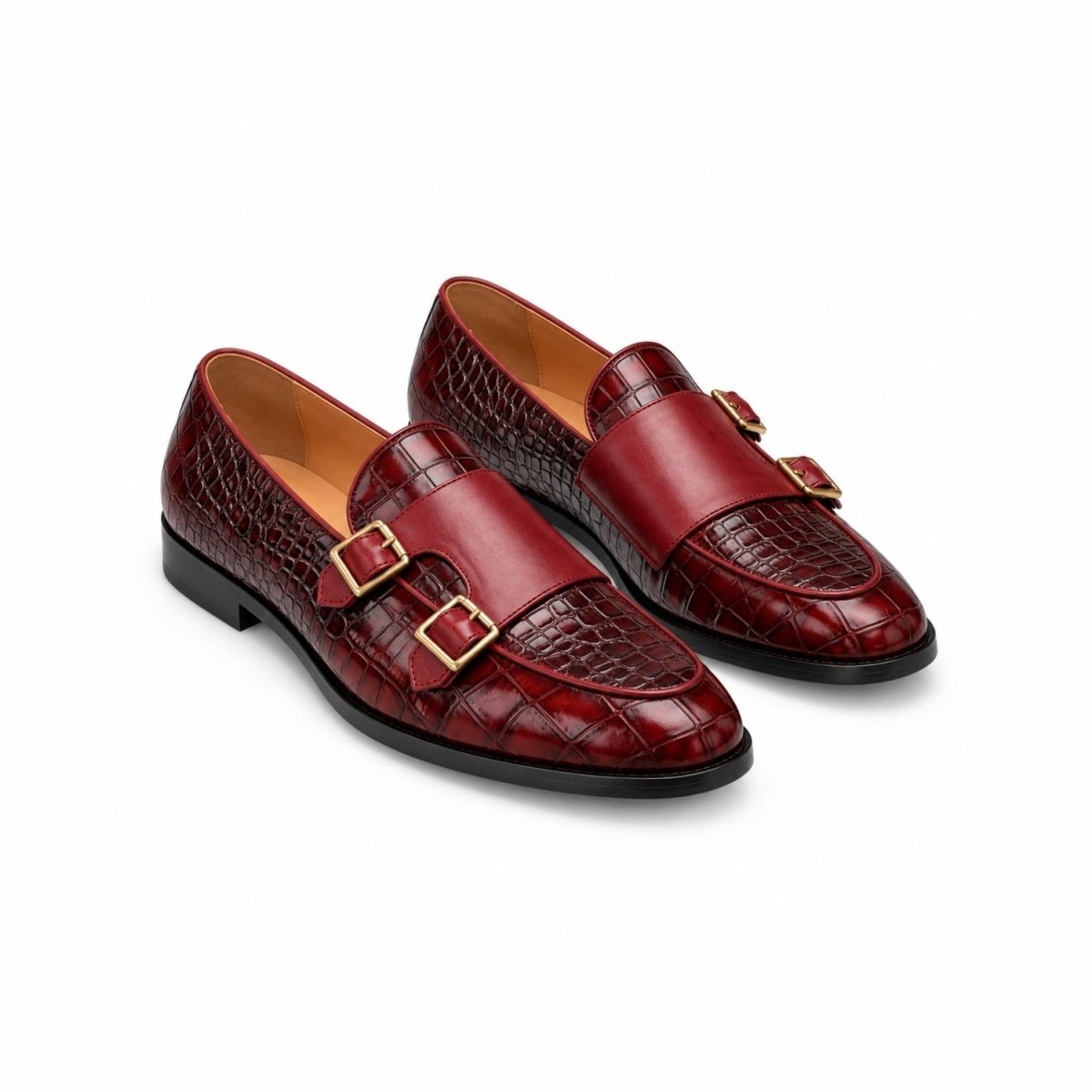 A pair of men's double buckle loafers in deep burgundy red, featuring a mix of smooth leather and crocodile-embossed textures, with gold-tone buckle details, shown on a plain white background.