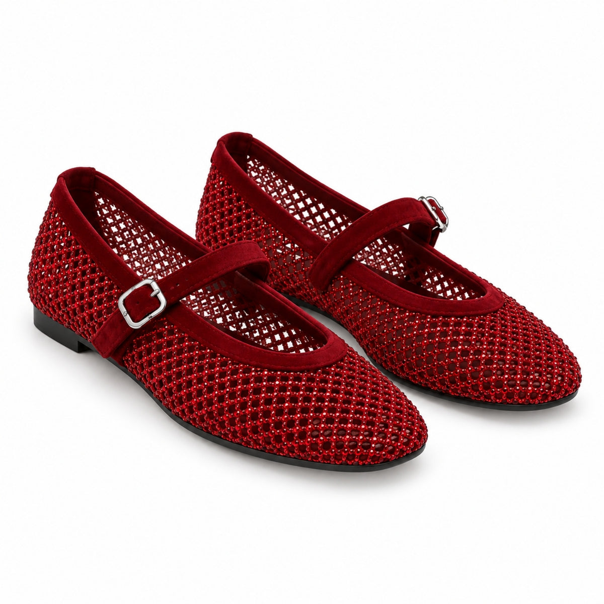 A pair of red open-knit mesh Mary Jane flats with velvet straps and silver buckle details, shown on a clean white background.