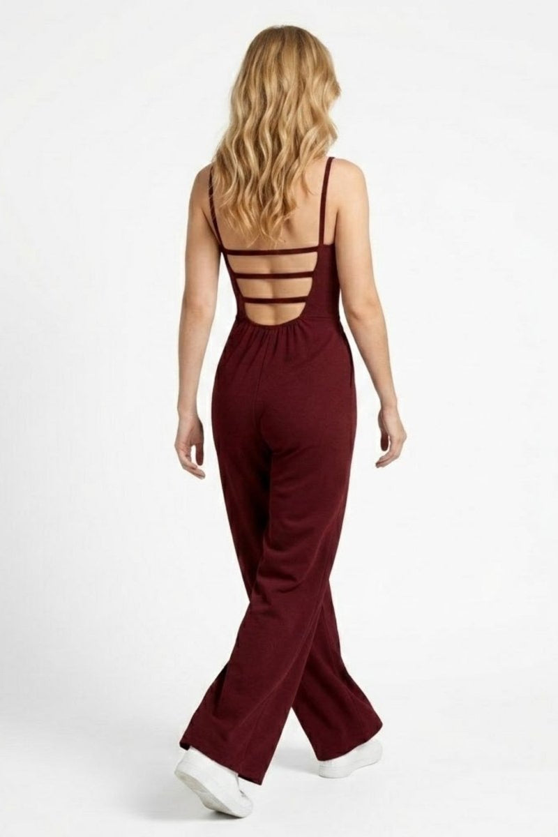 Back view of Fenlo Form wine red evening jumpsuit showcasing the architectural horizontal strappy open back detail.