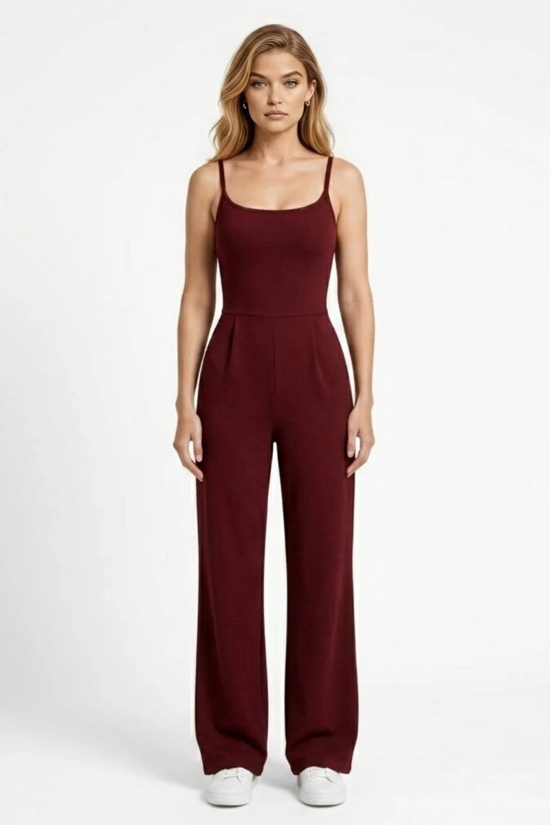 Woman wearing Fenlo Form wine red wide leg sleeveless jumpsuit facing forward in a clean studio setting.