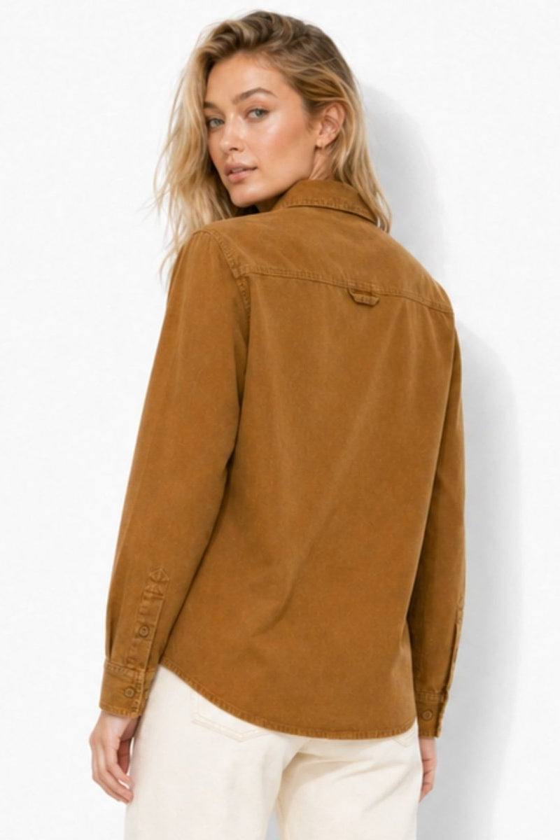Back view of woman wearing the Fenlo Form brown corduroy shacket top showing the structured yoke detailing