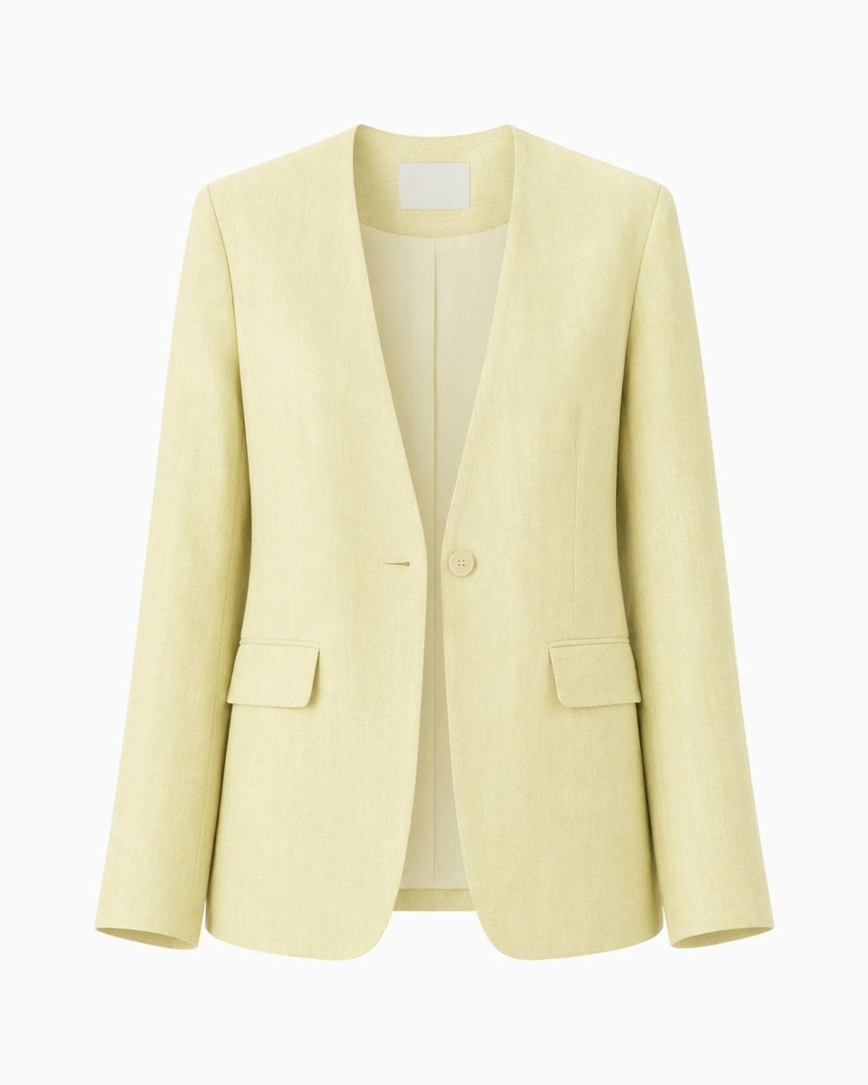 Ghost mannequin front view of Kouvr yellow collarless linen blazer showing single button and flap pockets.
