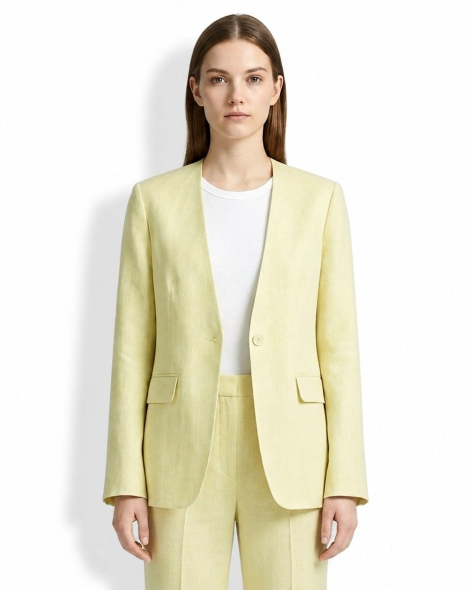 Woman wearing Kouvr yellow collarless linen blazer with white tee, facing forward.