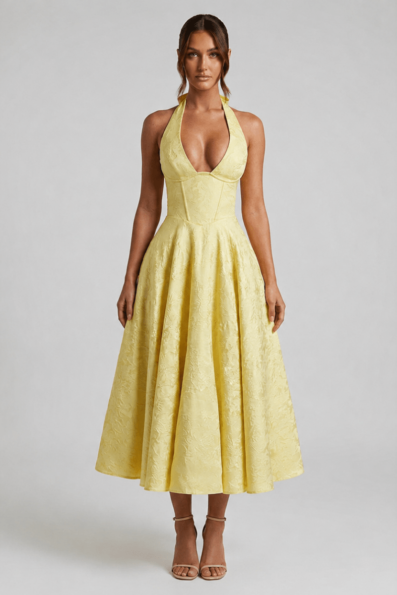 Front view of the Kouvr yellow floral jacquard halter corset midi dress featuring a plunging V-neckline and fit and flare skirt.