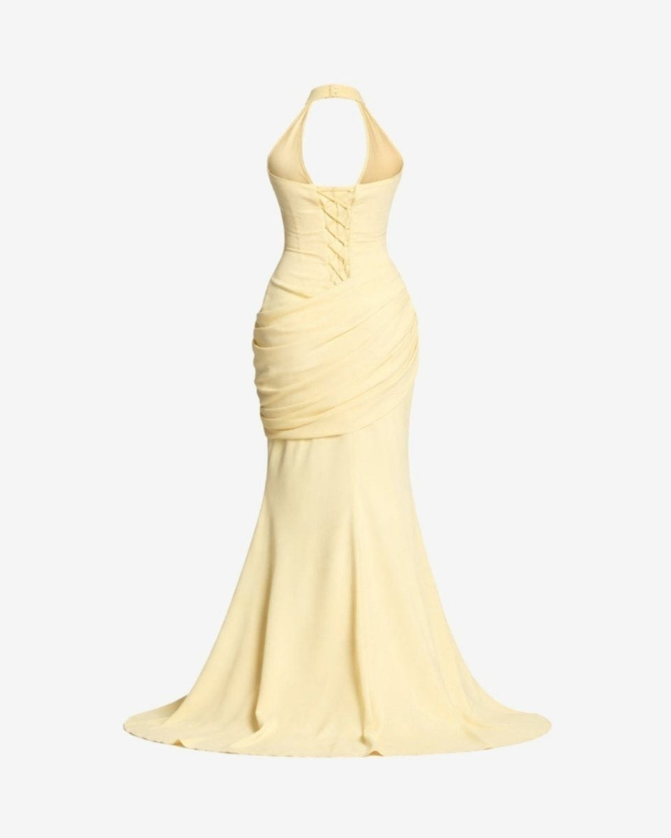 Ghost mannequin back view of the yellow formal dress detailing the intricate lace-up corset back and halter neck clasp.