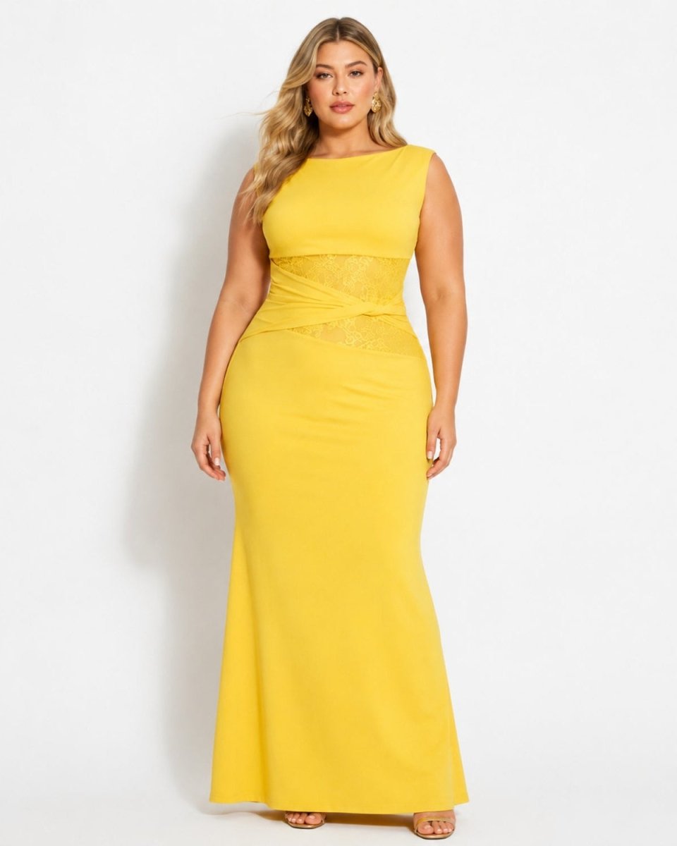 A woman modeling a sleeveless, floor-length yellow gown with a fitted silhouette and subtle textured detailing at the waist, photographed against a plain light gray studio background.