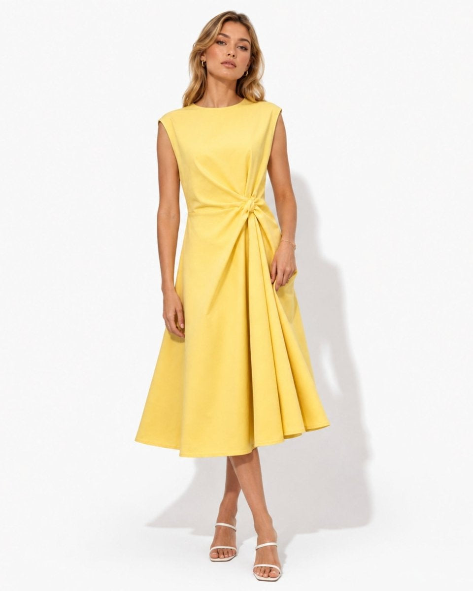 Front view of woman wearing elegant yellow sleeveless midi dress featuring a flattering twist knot waist and flared A-line skirt.