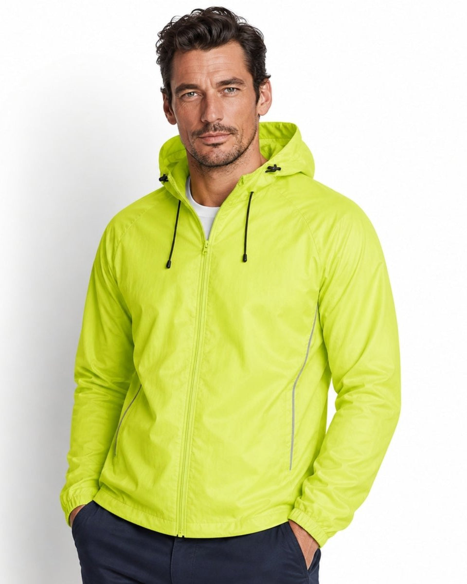 Male model wearing yellow lightweight hooded windbreaker jacket with front zipper and reflective details