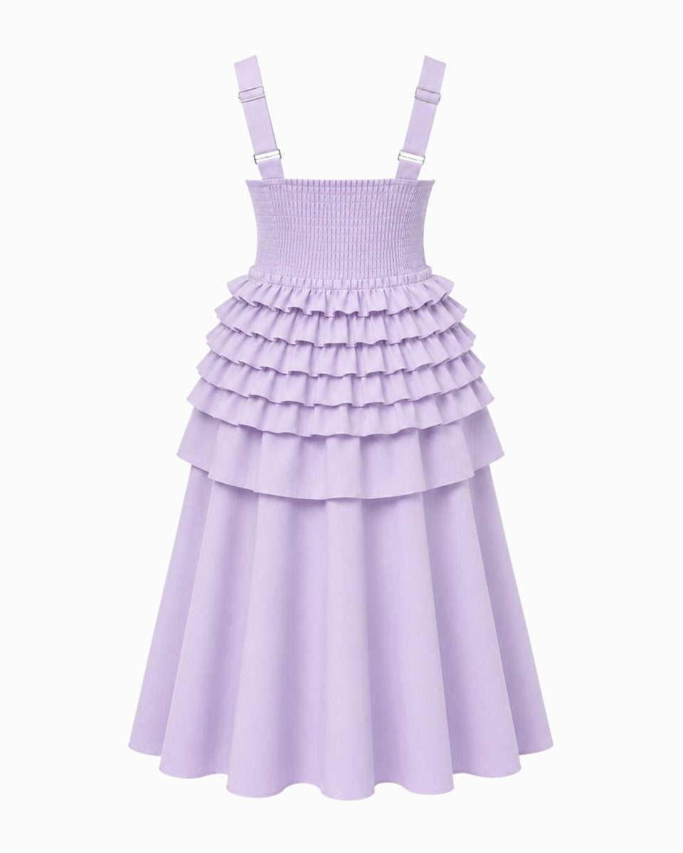 A light purple sleeveless dress with shoulder straps, a smocked bodice, and a tiered ruffle skirt, shown against a plain white background.