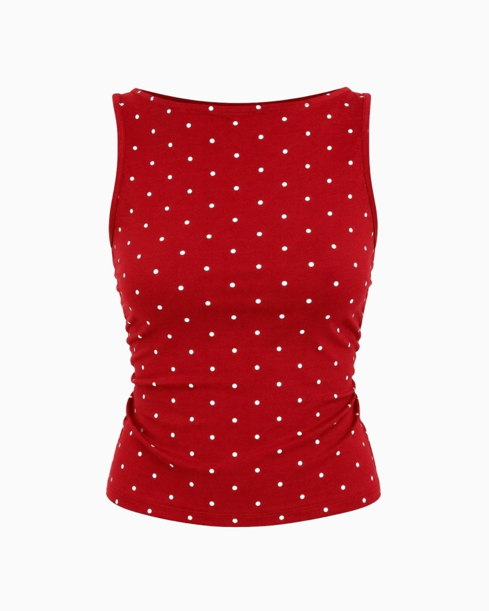 A sleeveless red top with a white polka dot pattern, displayed against a solid white background.