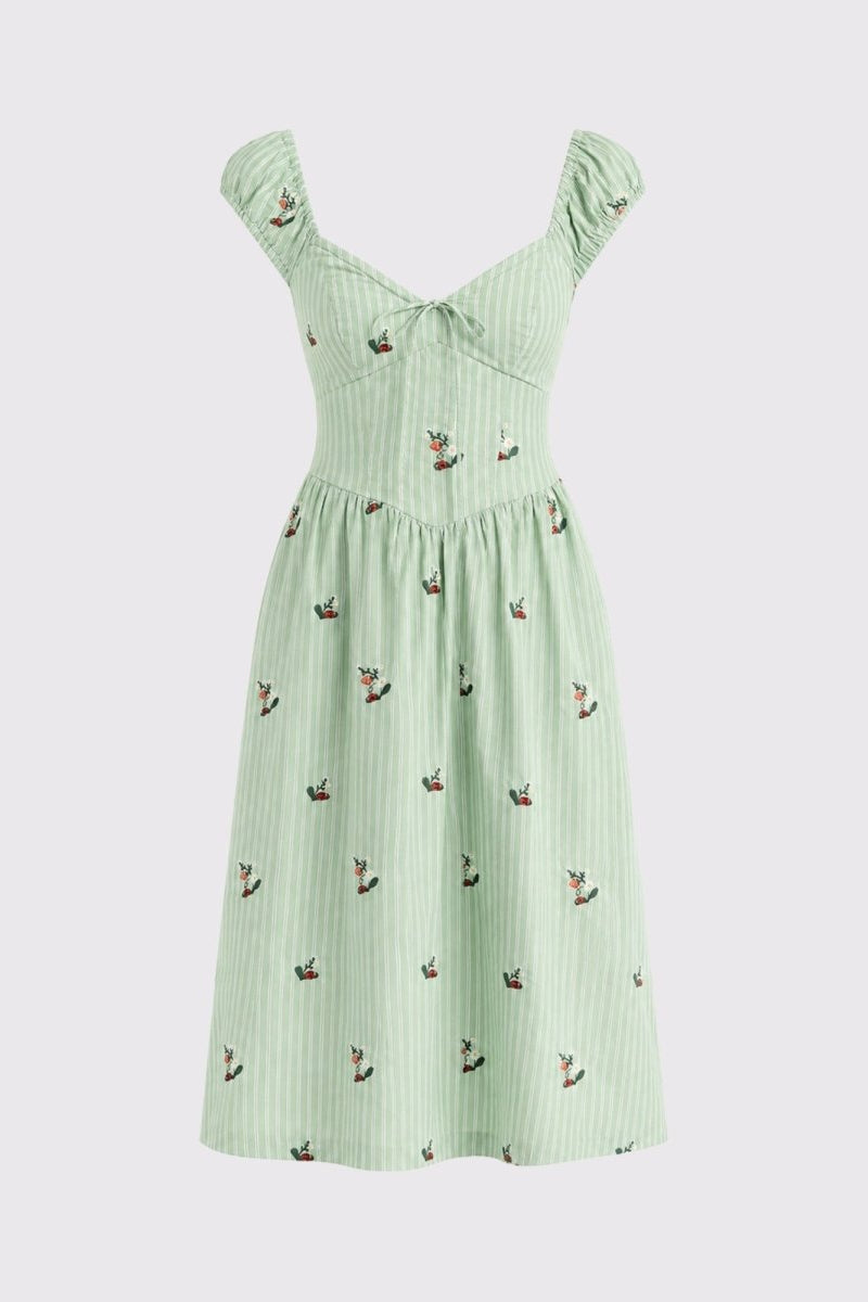 A light mint green sleeveless dress with a vertical stripe texture and small embroidered bird motifs, shown against a solid light gray background.