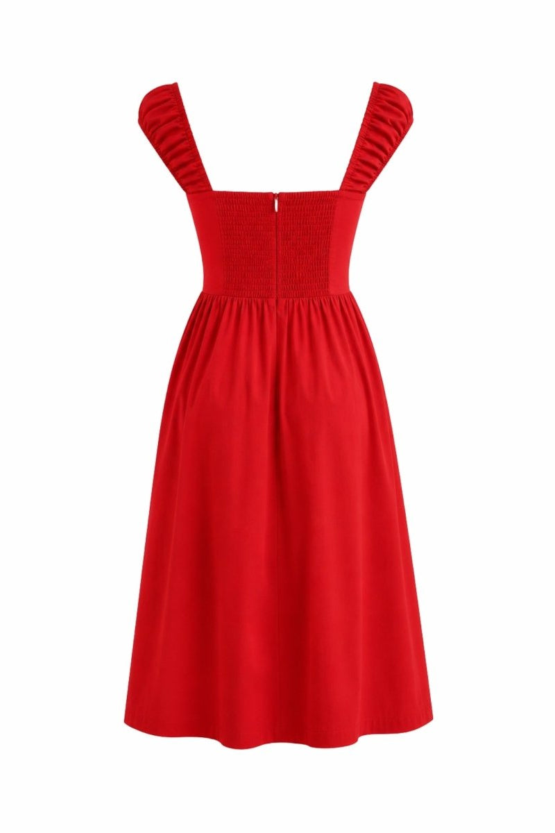 A bright red sleeveless dress with ruffled shoulder straps, a smocked bodice, and a flared skirt, shown against a plain white background.