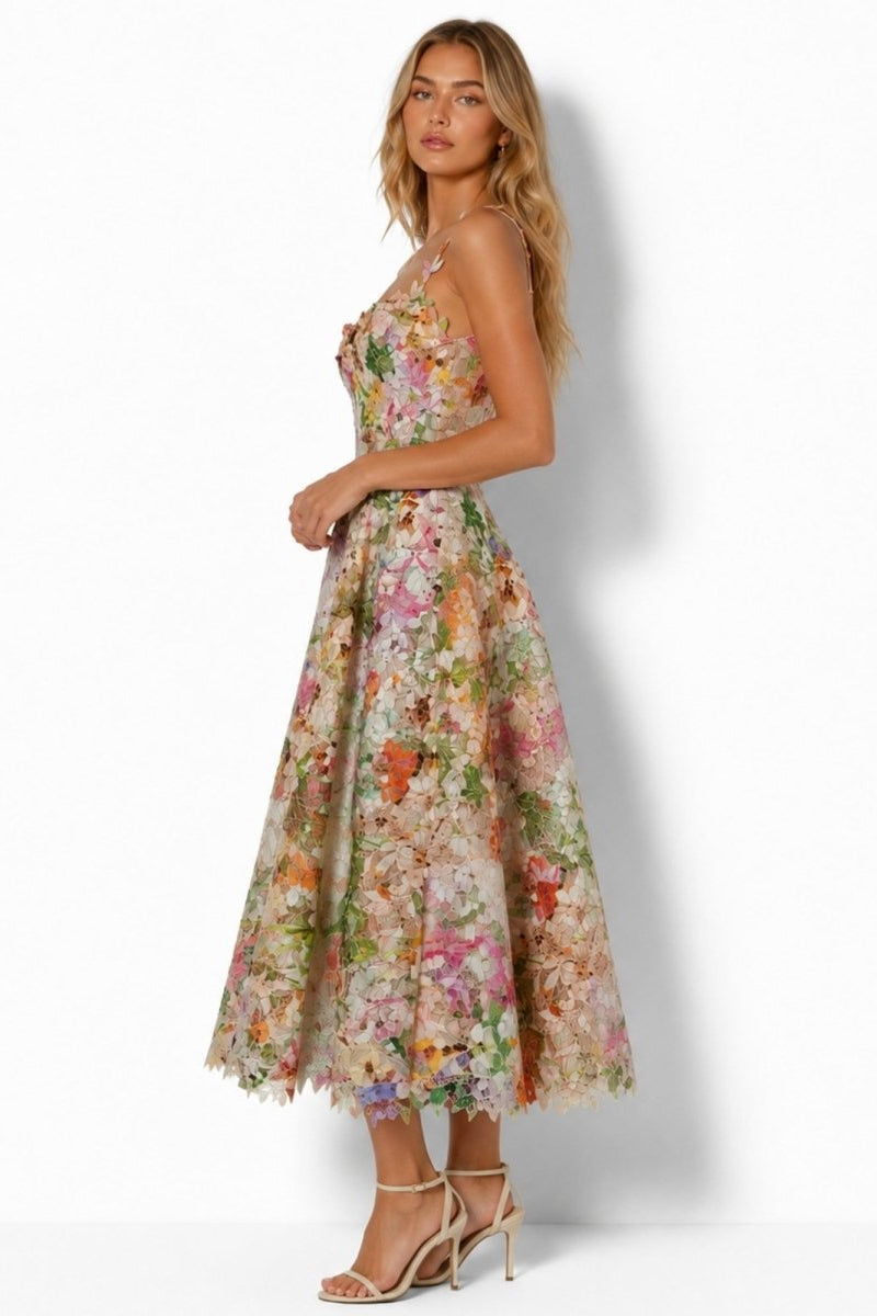 Side profile of model wearing Fenlo Form A-line floral wedding guest midi dress showing structured bodice fit.