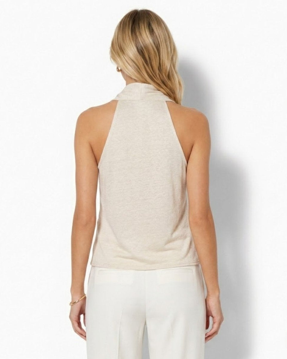 Back view of a minimalist beige sleeveless top showing the sophisticated cutaway shoulder design and clean tailored lines by Fenlo Form