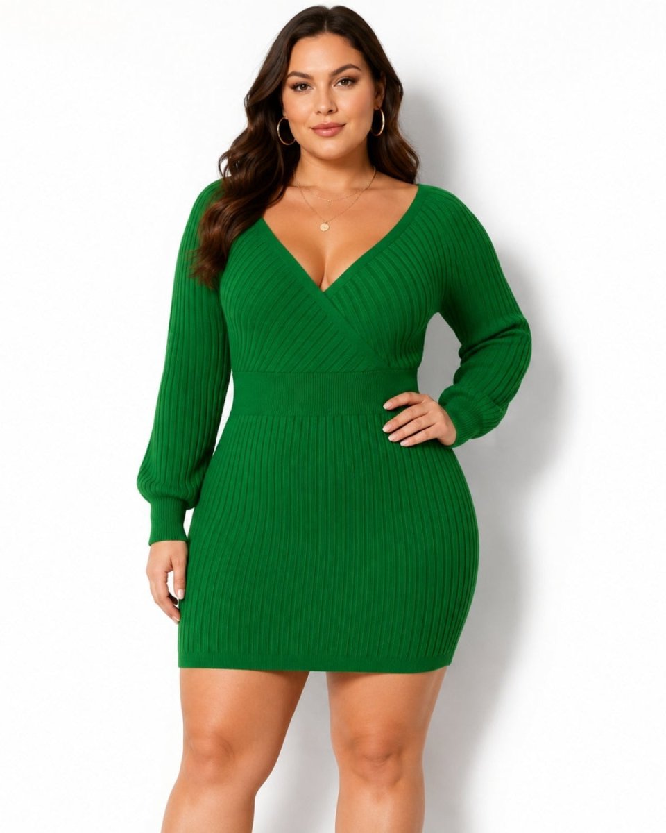 A woman modeling a green ribbed long-sleeve mini dress with a wrap-style V-neckline, photographed against a clean white studio background.