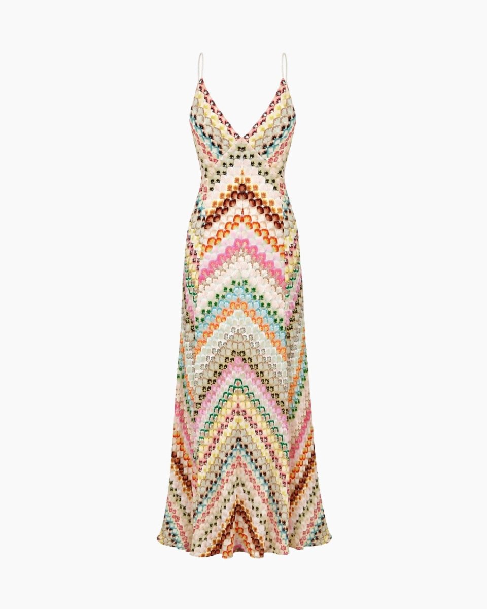A sleeveless maxi dress with thin spaghetti straps, featuring a V-neckline and an all-over multicolor chevron knit pattern on a cream base, shown against a plain white background.