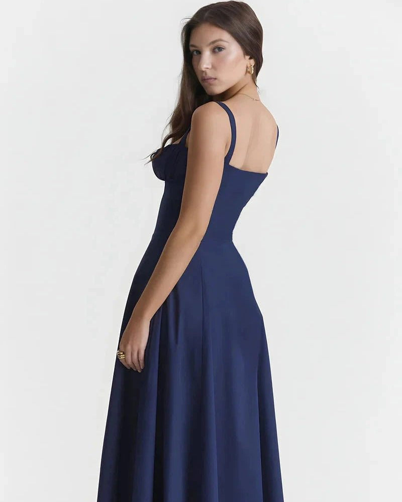 Navy blue dress worn by a model on a white background