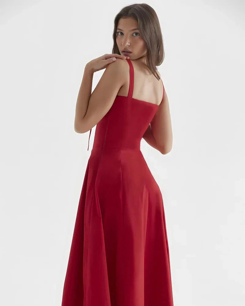 Woman wearing a red dress on a white background