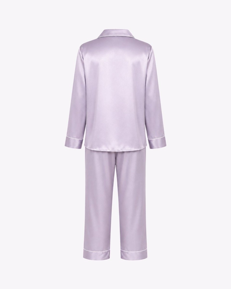 A lavender satin pajama set with a long-sleeve button-up top and matching wide-leg pants, shown from the back on a light gray background.