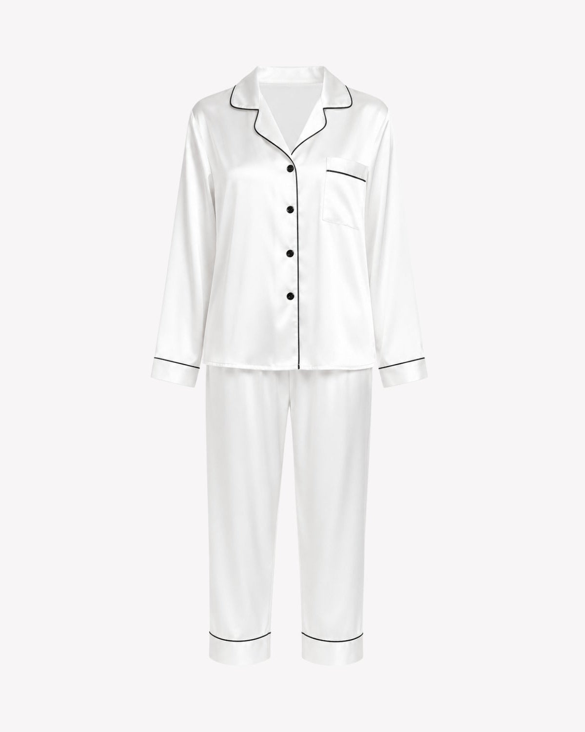 A two-piece white satin pajama set with black piping trim, including a long-sleeve button-up top and matching pants, displayed on a clean white background.