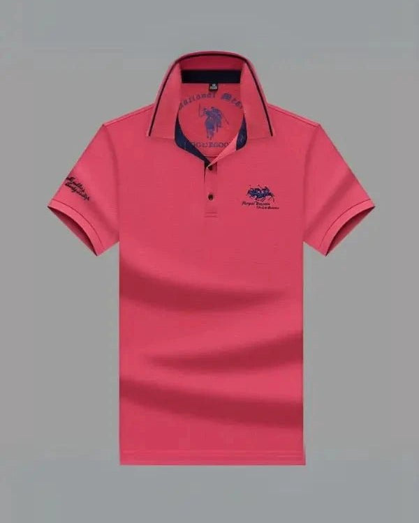 Pink polo shirt with a brand logo on a gray background