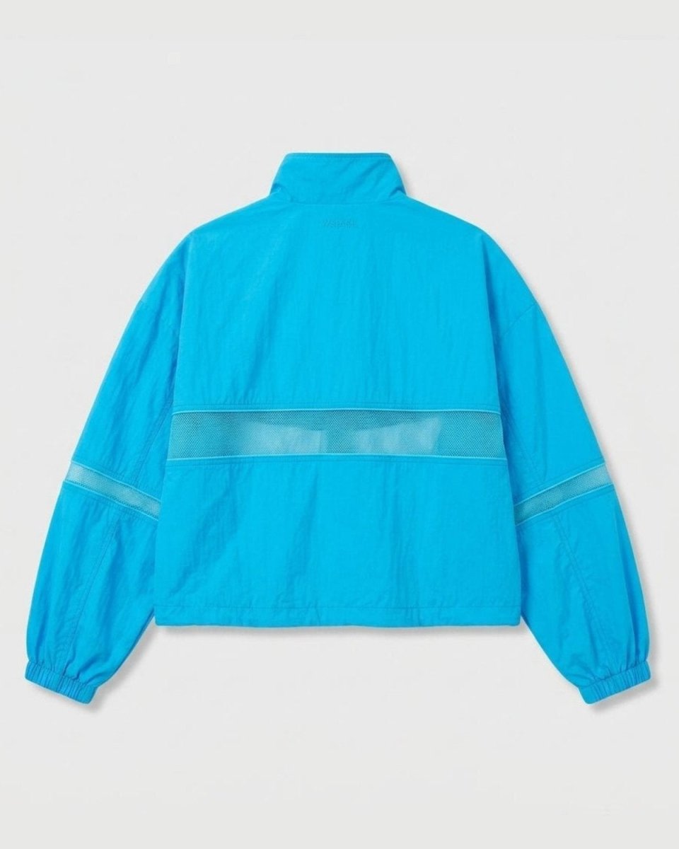 A bright turquoise blue windbreaker jacket shown from the back, featuring a horizontal sheer mesh stripe across the upper back and matching sheer mesh bands on the sleeves, set against a light gray background.