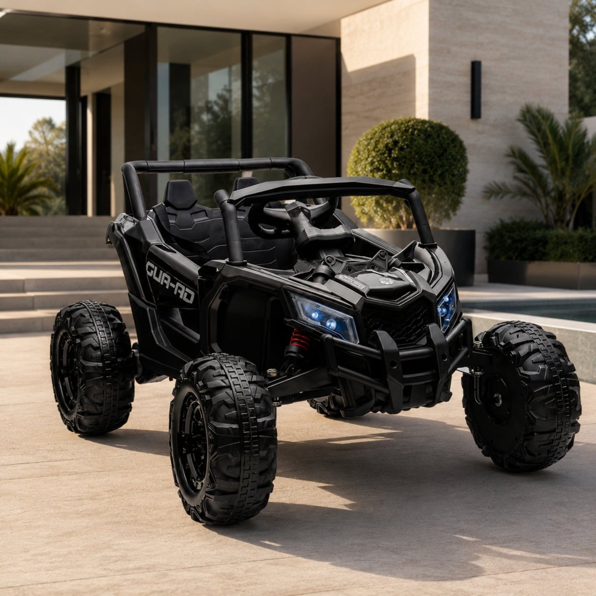 Studio profile shot of a sleek, all-black 24V kids' ride-on electric buggy parked on a modern patio next to a swimming pool.