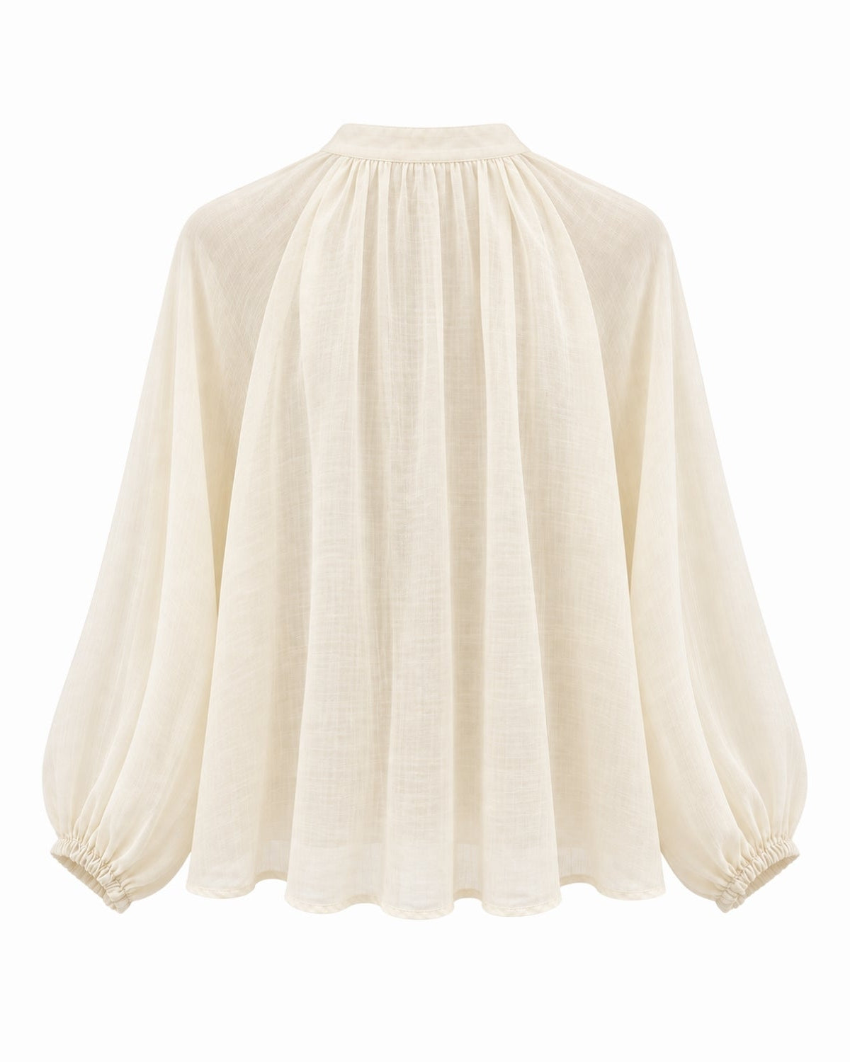 An apricot long-sleeve blouse with a gathered high neckline, pleated front, and elasticized cuffs, shown against a plain white background.