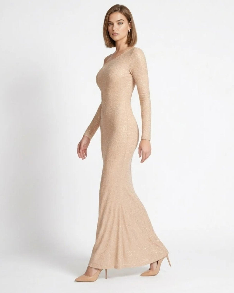 Elegant champagne sparkly bodycon evening gown side profile view showing tailored silhouette