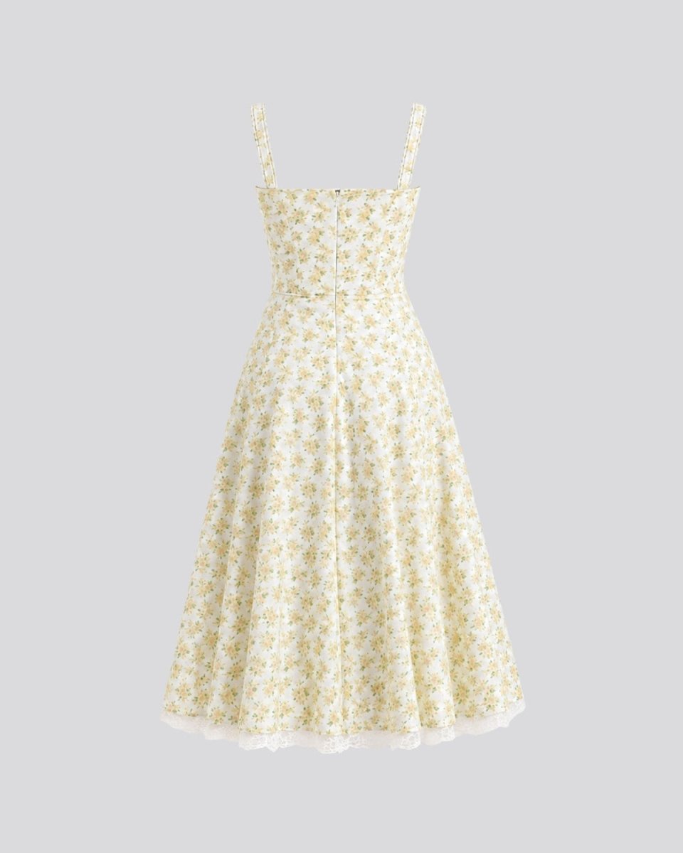 A sleeveless A-line midi dress with thin shoulder straps, featuring a fitted bodice and a flared skirt in a small yellow and white floral print, shown against a solid gray background.