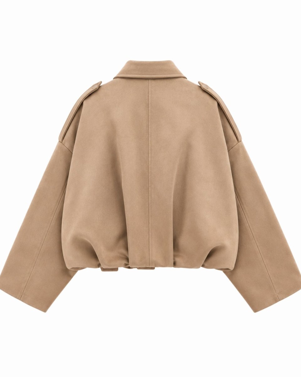 A cropped beige jacket with a wide collar, shoulder epaulets, and voluminous long sleeves, shown from the back on a solid white background.
