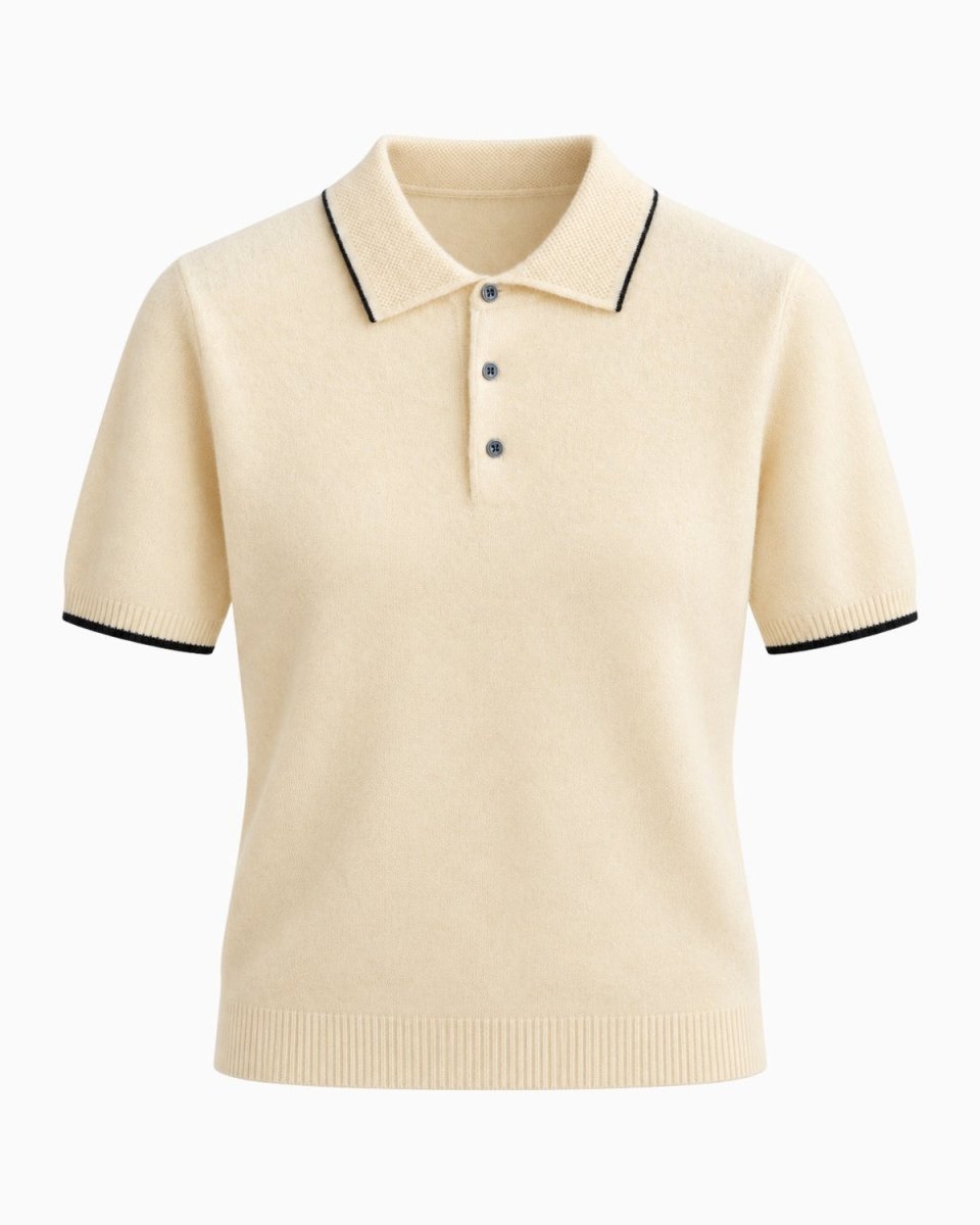 A beige-colored short-sleeve knit polo shirt with black contrast piping on the collar and sleeve cuffs, featuring a three-button placket, shown against a plain white background.