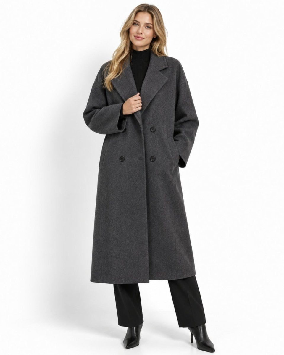 Woman modeling a luxurious oversized double breasted long wool coat for winter, demonstrating a relaxed elegant fit.
