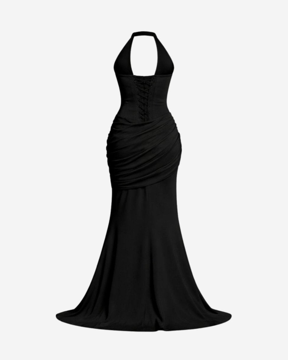 Back view of a black formal gown on an invisible ghost mannequin, displaying the adjustable corset back string details and flared hem.