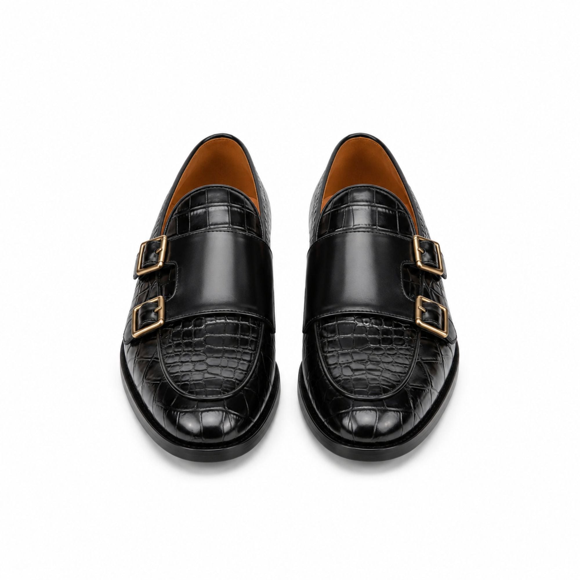 A pair of black double monk loafers with a glossy crocodile-embossed toe cap and gold-tone buckle straps, shown from a top-down view on a white background.