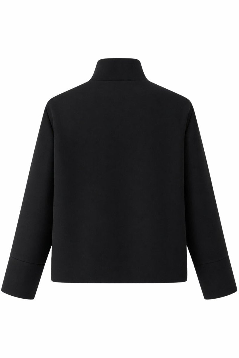 Flat lay back view of the Fenlo Form black minimalist cropped jacket showing clean modern tailoring and wide cuffs.