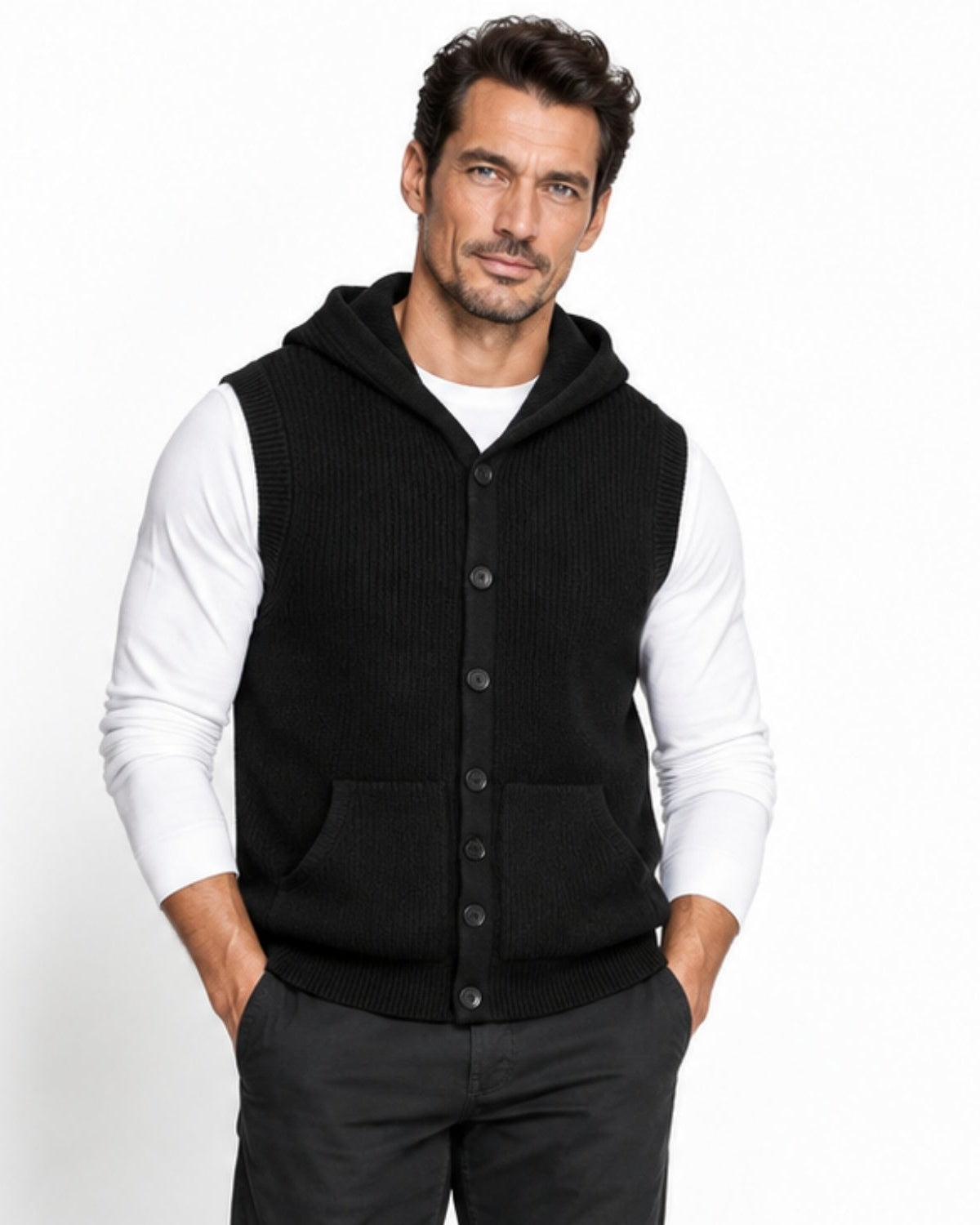 Mature man wearing a black luxury hooded sweater vest with a button down front layered over a white long sleeve shirt