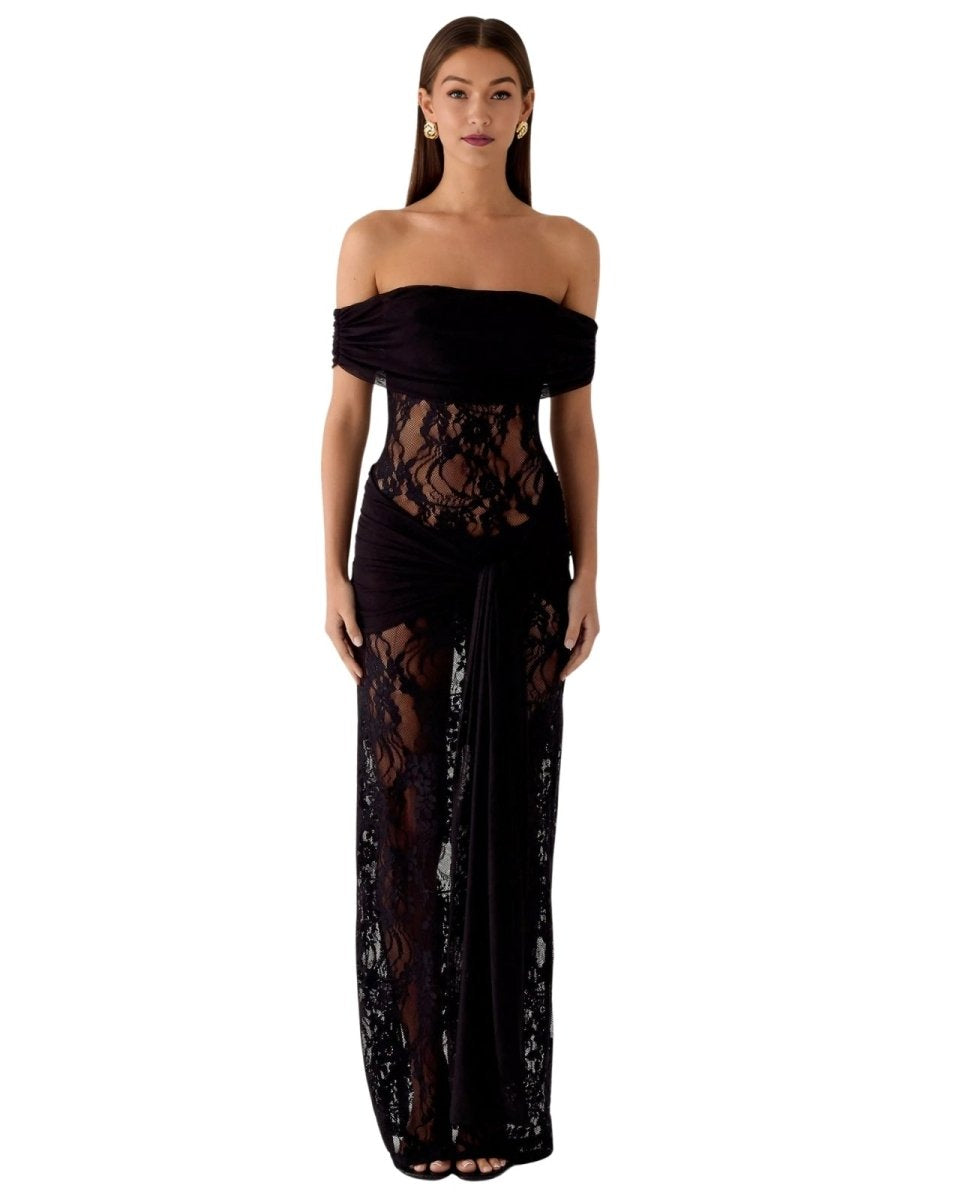 Woman wearing a black Fenlo  strapless lace gown on a white background