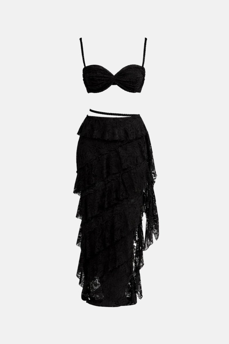 A black two-piece lace set featuring a strapless sweetheart bustier top and a matching tiered ruffle maxi skirt, displayed against a solid light gray background.