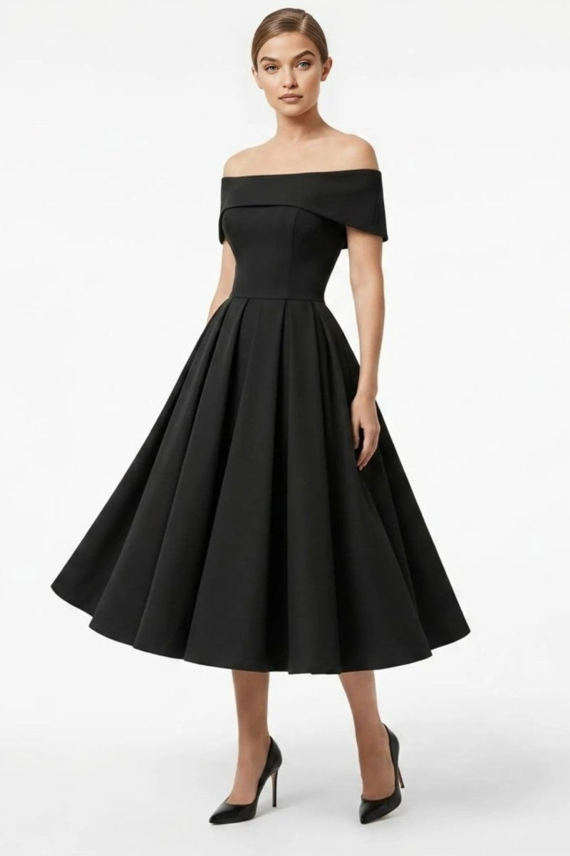 Elegant woman wearing a black off the shoulder midi dress with a structured bodice and pleated A-line skirt
