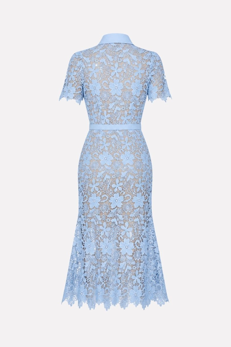 Flat lay back view of light blue floral lace dress with scalloped hem.