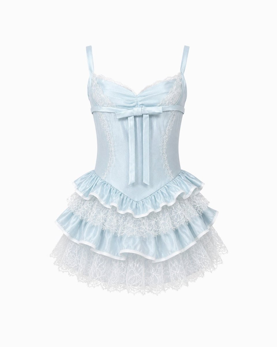 Flat lay front view of a luxury light blue satin bustier dress featuring a center ribbon bow and alternating lace skirt tiers.