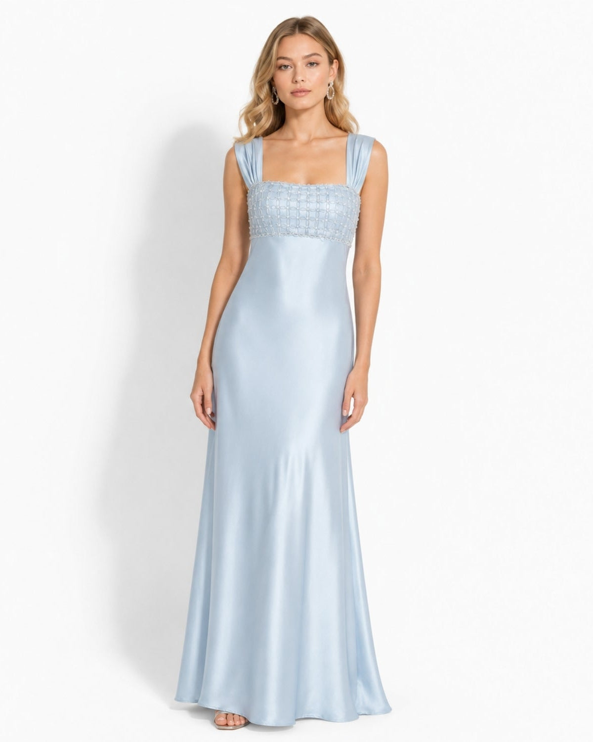 Elegant blue satin formal evening gown with hand-beaded square bodice worn by a model