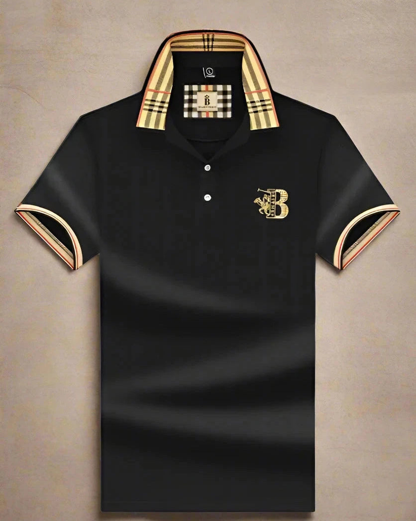 Black polo shirt with gold accents and brand logo on a beige background